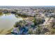 Aerial view of townhouses with a lake view and covered parking at 6910 Lake Place Ct, Tampa, FL 33634