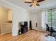 This bedroom features a ceiling fan, hardwood floors, and a closet at 6910 Lake Place Ct, Tampa, FL 33634