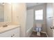 Clean bathroom featuring new vanity, toilet, and tiled shower at 701 15Th S Ave, St Petersburg, FL 33701