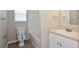 Comfortable bathroom featuring new vanity, toilet, and tiled shower at 701 15Th S Ave, St Petersburg, FL 33701