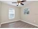 Bedroom featuring wood-look floors and natural light from two windows at 701 15Th S Ave, St Petersburg, FL 33701