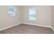 Cozy bedroom featuring hardwood floors and bright windows at 701 15Th S Ave, St Petersburg, FL 33701