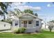Charming home featuring a covered front porch, fresh landscaping, and a freshly painted exterior at 701 15Th S Ave, St Petersburg, FL 33701