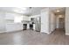 Open kitchen featuring stainless steel appliances, white cabinets, and hardwood floors at 701 15Th S Ave, St Petersburg, FL 33701