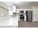 Stylish kitchen featuring stainless steel appliances, white cabinets, and quartz countertops at 701 15Th S Ave, St Petersburg, FL 33701