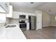 Bright kitchen featuring stainless steel appliances and white cabinets at 701 15Th S Ave, St Petersburg, FL 33701
