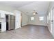 Open floor plan view of living room and kitchen featuring hardwood floors at 701 15Th S Ave, St Petersburg, FL 33701
