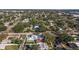 Aerial view of a house and neighborhood, surrounded by trees, showing the property's location at 713 43Rd N Ave, St Petersburg, FL 33703