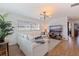 Inviting living room featuring a comfortable sofa, large windows, and hardwood flooring at 713 43Rd N Ave, St Petersburg, FL 33703