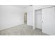 Bright bedroom featuring carpet, closet with sliding doors, and access to a hallway at 7529 62Nd N Way, Pinellas Park, FL 33781