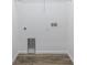 A utility room with washer/dryer hookups and wood-look flooring at 7529 62Nd N Way, Pinellas Park, FL 33781