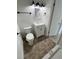 Updated bathroom with modern fixtures, flooring and a large vanity at 7563 Meadowlawn N Dr, St Petersburg, FL 33702