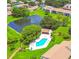 Aerial view of the community pool and pond at 7623 Radcliffe Cir # 211A, Port Richey, FL 34668
