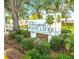 Entrance sign to the deed-restricted over 55 community at 7623 Radcliffe Cir # 211A, Port Richey, FL 34668