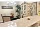 Inviting dining room featuring a glass-top table, chandelier, and elegant decor at 7623 Radcliffe Cir # 211A, Port Richey, FL 34668