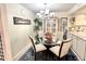 Comfortable dining space with a glass table, chandelier, and tasteful decorative accents at 7623 Radcliffe Cir # 211A, Port Richey, FL 34668