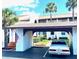 Exterior view of building featuring a convenient covered parking spot and welcoming entrance at 7623 Radcliffe Cir # 211A, Port Richey, FL 34668