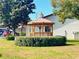 Community gazebo surrounded by lush greenery offering a tranquil gathering space at 7623 Radcliffe Cir # 211A, Port Richey, FL 34668