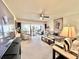 Bright living room with plush carpeting, comfortable furnishings, and a view of the outdoor patio at 7623 Radcliffe Cir # 211A, Port Richey, FL 34668