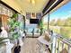 Charming patio featuring comfortable seating, decorative plants, and a view of the surrounding landscape at 7623 Radcliffe Cir # 211A, Port Richey, FL 34668