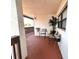 Comfortable outdoor patio area furnished with chairs and decorative potted plants, perfect for relaxation at 7623 Radcliffe Cir # 211A, Port Richey, FL 34668
