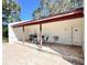 Community patio with a table, chairs, drinking fountain, and restrooms for community members at 7623 Radcliffe Cir # 211A, Port Richey, FL 34668