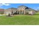 Charming single-Gathering home with a well-manicured lawn and a two-car garage at 8977 Players Dr, Brooksville, FL 34613