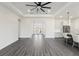 Open-concept area with a modern kitchen, French doors and sleek hardwood floors at 8977 Players Dr, Brooksville, FL 34613