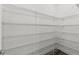 Walk-in pantry with lots of wire shelving at 8977 Players Dr, Brooksville, FL 34613