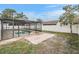 Backyard view of the pool and screen enclosure is a perfect backyard oasis at 9724 Cypress Shadow Ave, Tampa, FL 33647