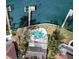 Aerial view of backyard pool and dock overlooking the water at 1118 Monterey Ne Blvd, St Petersburg, FL 33704