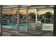 Covered deck with views of the pool, waterfront, and private boat docks at 1118 Monterey Ne Blvd, St Petersburg, FL 33704