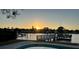 Waterfront view of the docks and water at sunset at 1118 Monterey Ne Blvd, St Petersburg, FL 33704