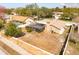 Bird's eye view of a home with a screened in patio, fenced yard, and lush trees at 1240 Ridgegrove S Dr, Palm Harbor, FL 34683