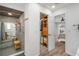 Bathroom with a large shower featuring a built-in bench and wood accents in the ceiling at 1240 Ridgegrove S Dr, Palm Harbor, FL 34683