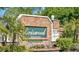 Beautiful brick entrance sign to the Griswood community surrounded by lush landscaping at 1240 Ridgegrove S Dr, Palm Harbor, FL 34683