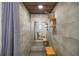 Sleek shower with a wood trimmed ceiling, dual shower heads and a built in bench at 1240 Ridgegrove S Dr, Palm Harbor, FL 34683
