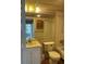 Bathroom featuring a vanity with a mirror, a toilet, and a shower/tub combination at 1811 Bedford Ln # 162, Sun City Center, FL 33573