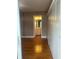 Bedroom view showcasing hardwood floors, full wall closet and access to the bathroom at 1811 Bedford Ln # 162, Sun City Center, FL 33573
