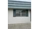 Exterior home detail with shutters and the address 162 at 1811 Bedford Ln # 162, Sun City Center, FL 33573