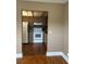 Bright kitchen featuring laminate floors, white appliances, and ample cabinet space at 1811 Bedford Ln # 162, Sun City Center, FL 33573
