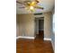 Comfortable living room featuring wood-look floors and ample space at 1811 Bedford Ln # 162, Sun City Center, FL 33573