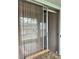 Sunroom with sliding glass doors and view of the enclosed closet at 1811 Bedford Ln # 162, Sun City Center, FL 33573