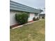 Lush green yard with attractive shrubbery and mulch landscaping at 1811 Bedford Ln # 162, Sun City Center, FL 33573
