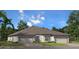 Charming one-story duplex with two-car garage and lush landscaping at 2016 Sidney St, Clearwater, FL 33763