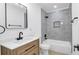 Updated bathroom featuring modern fixtures and stylish tiling at 2540 W Pine St, Tampa, FL 33607