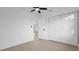 This spacious bedroom offers neutral walls, a ceiling fan, and a large closet at 2540 W Pine St, Tampa, FL 33607