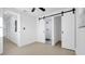 Bedroom featuring sliding doors to an ensuite bathroom with tiled shower at 2540 W Pine St, Tampa, FL 33607