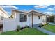 Cozy home with a well-maintained lawn and covered parking, showcasing curb appeal at 2540 W Pine St, Tampa, FL 33607