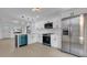 Bright kitchen with white cabinets, stainless steel appliances, and a stylish island at 2540 W Pine St, Tampa, FL 33607